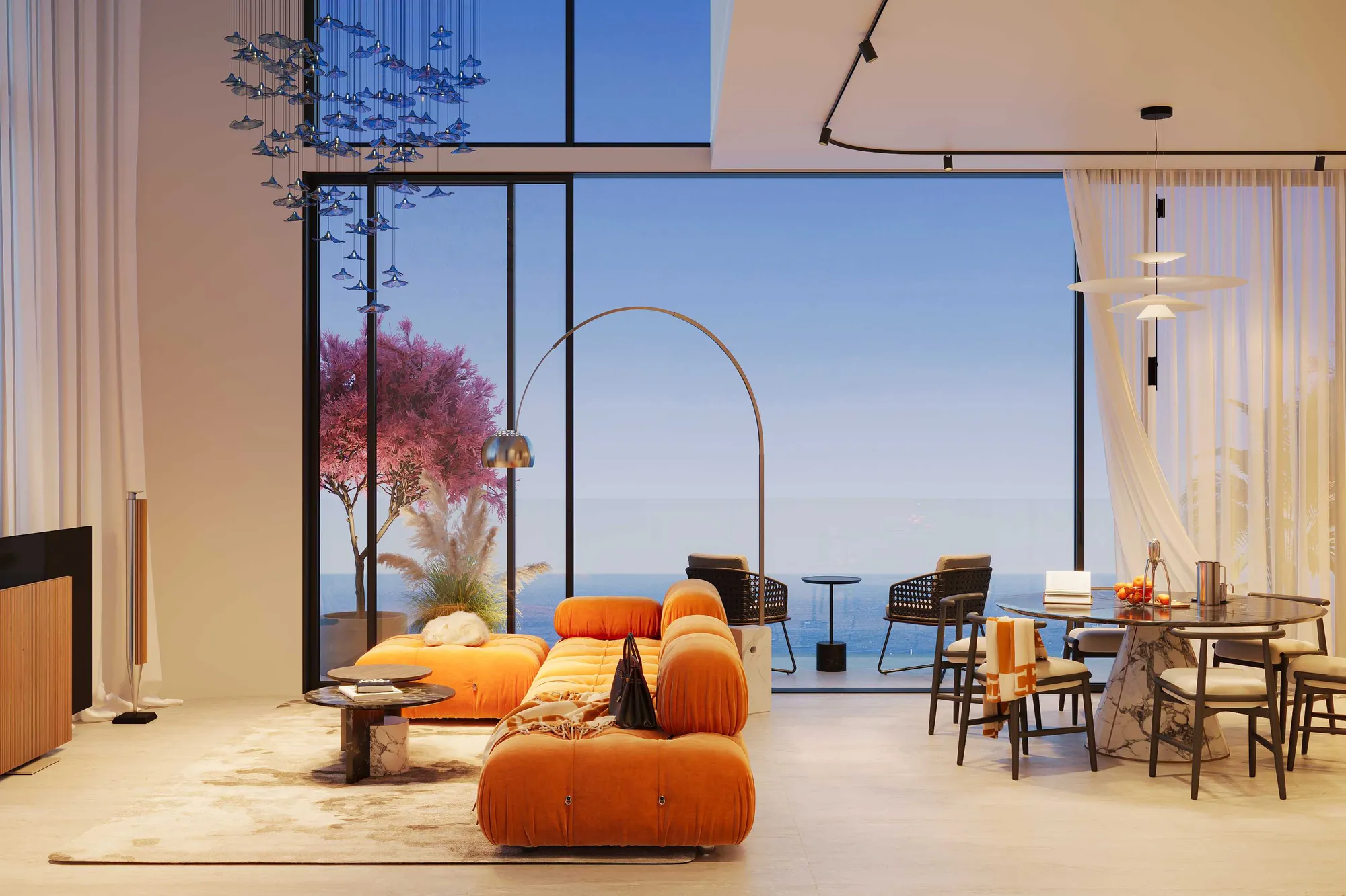 Double-height living room with orange sofa and floor-to-ceiling sea-view windows