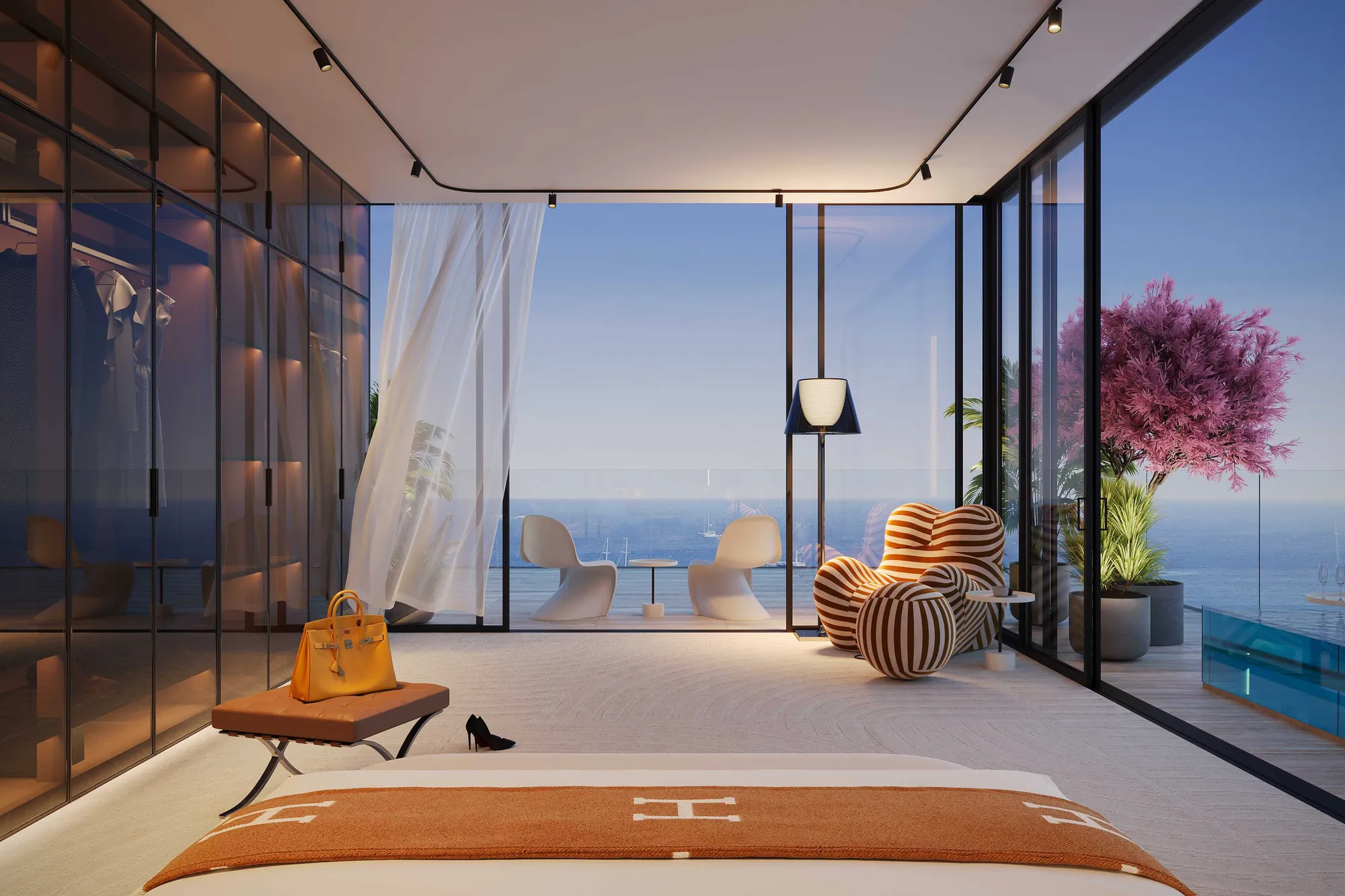 Bedroom with glass wall opening onto a terrace pool and the sea
