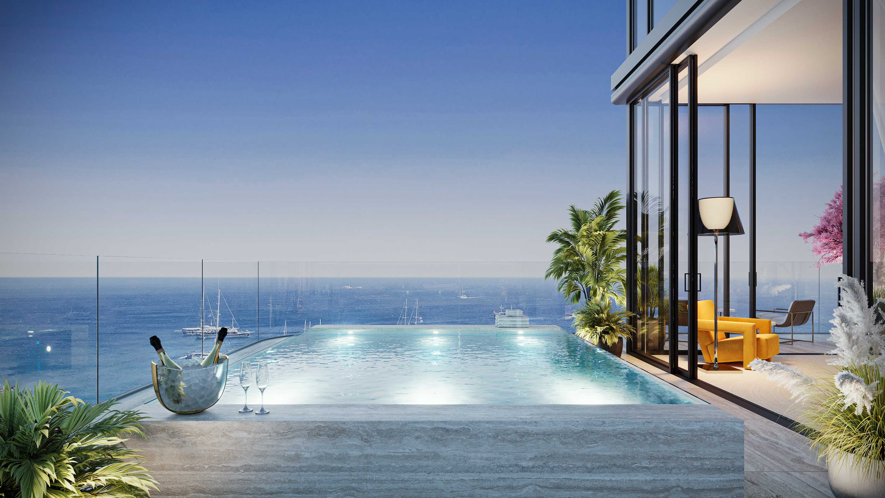 Infinity-edge terrace pool in travertine overlooking yachts on the sea