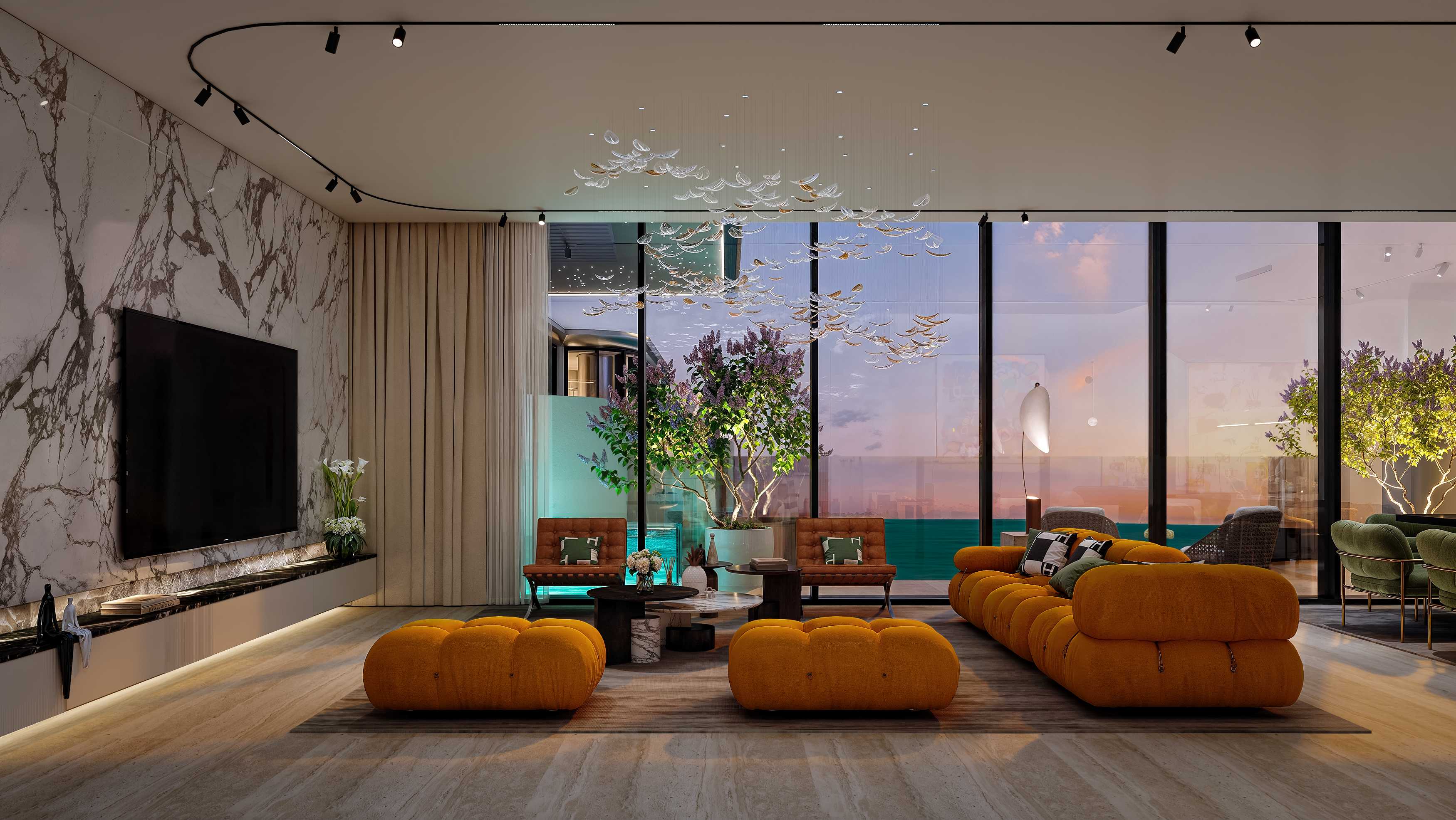 Large living room with marble wall, glass chandelier and evening sea view